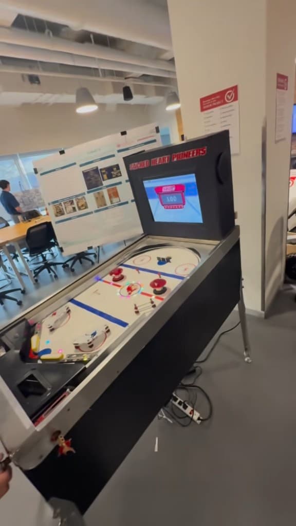 Sacred Heart Pioneers hockey-themed pinball machine with digital scoreboard